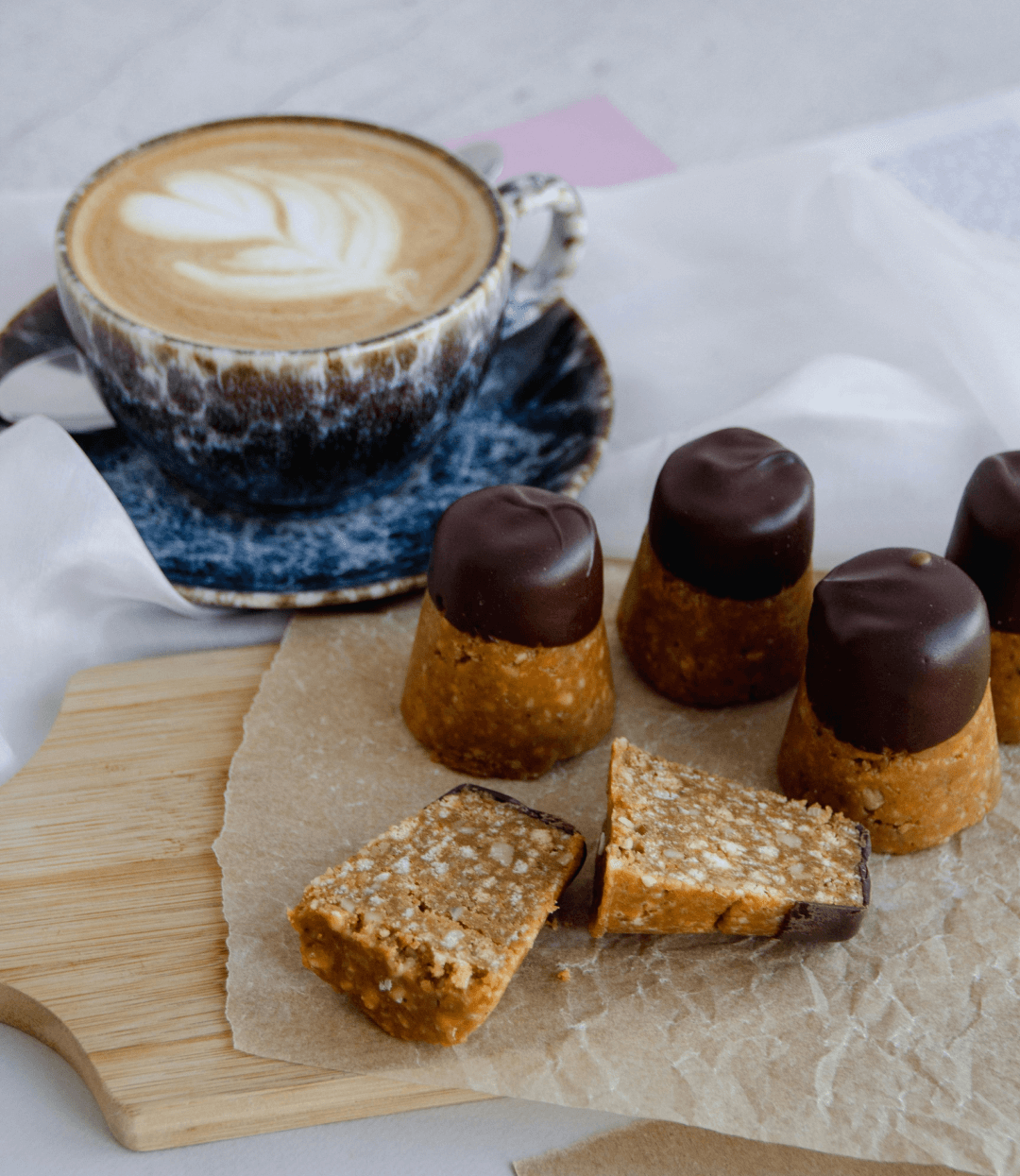 Coffee cup with desserts on the side